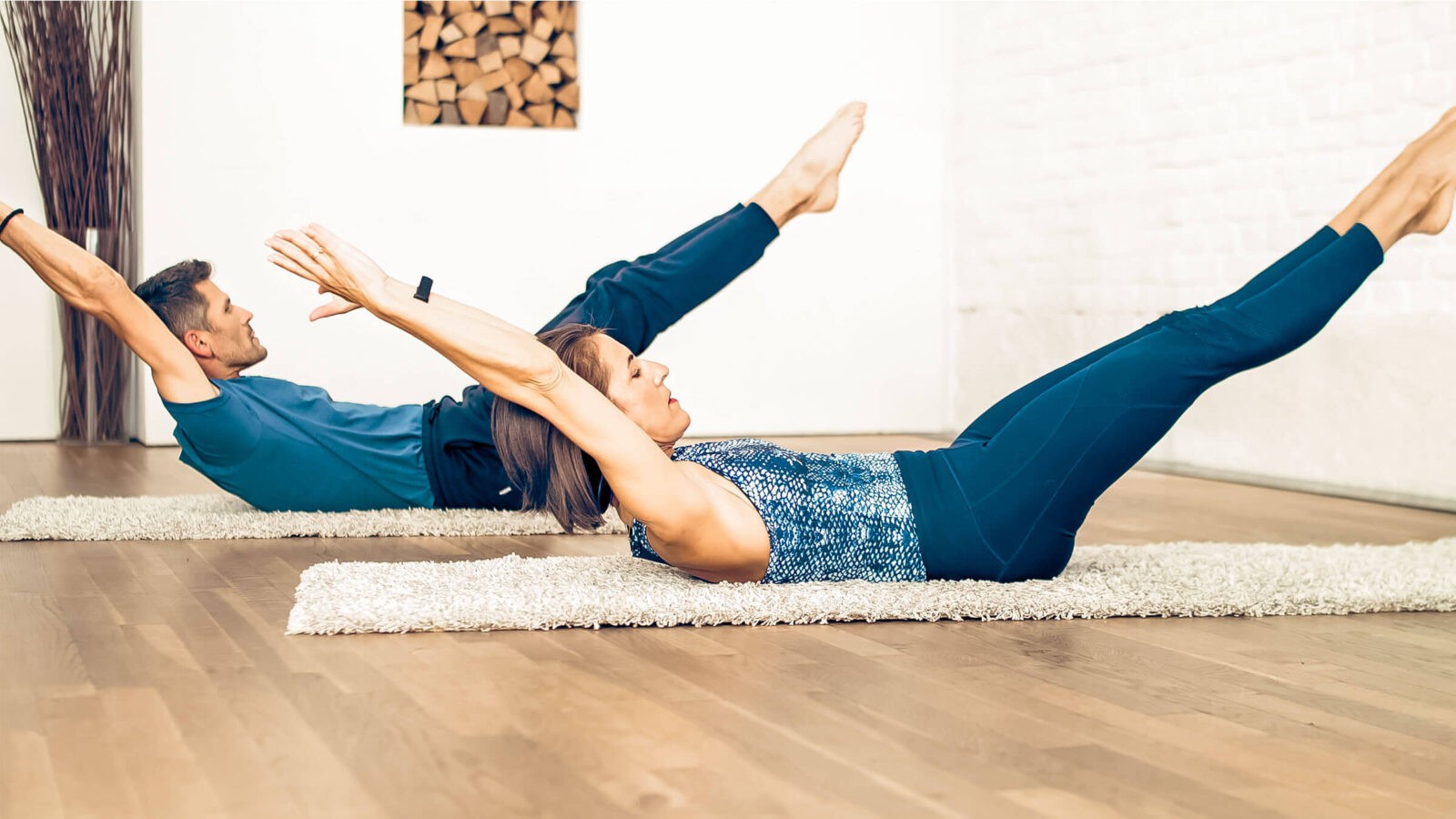 Maria and Wolfgang doing the Pilates exercise Double Leg Stretch